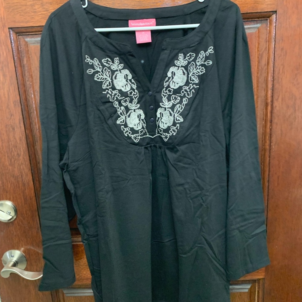 Woman Within Black Tunic with Floral Embroidery